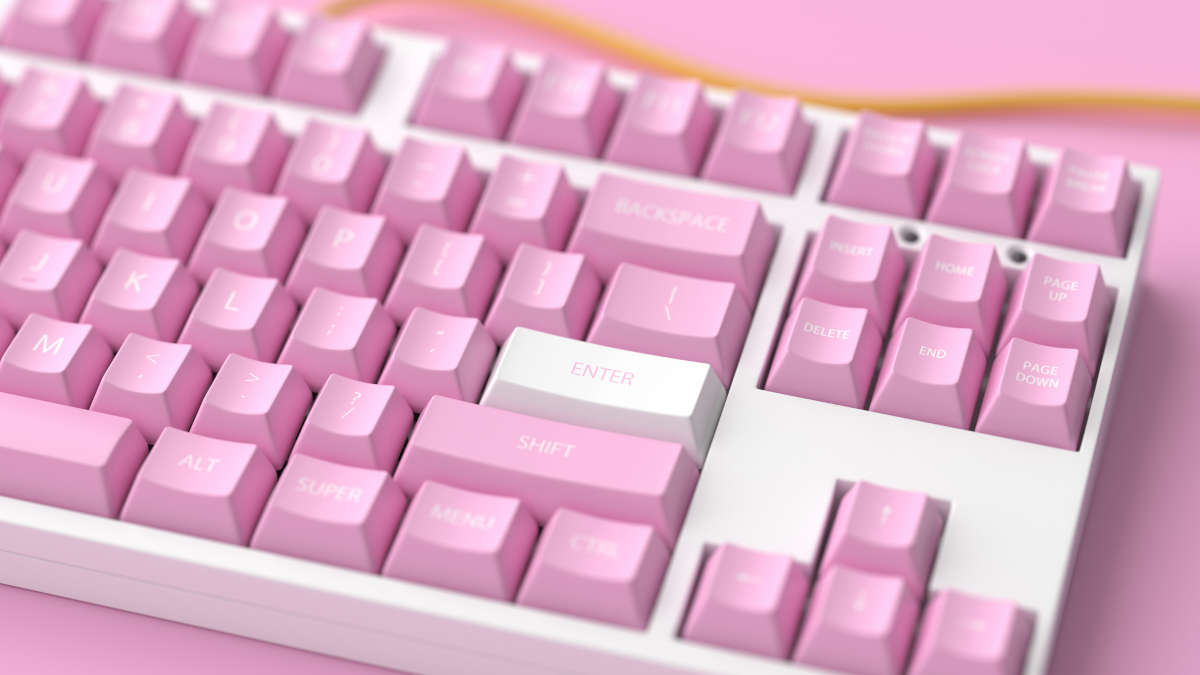 Nahaufnahme einer weißen Tastatur mit rosa Tasten
